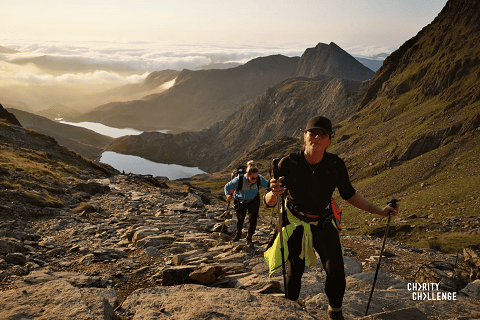 2 people walking up a hill