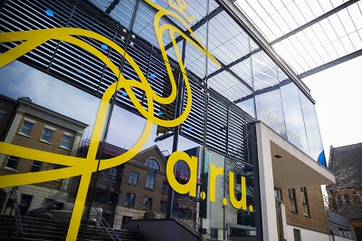 Photo of a glass building with ARU logo on it