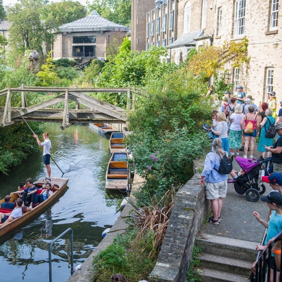 Punts on river and people watching on a sunny day 