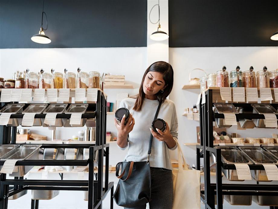 A lady in a supermarket choosing products