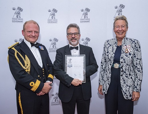 James Rolfe (centre) receiving the award on behalf of ARU from Julie Spence (Lord Lieutenant of Cambridgeshire) and Commodore Rob Bellefield CBE ADC RN – NRC EE.