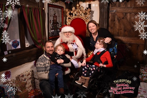 Family of seven year-old Isabel Nicole from Ely who use EACH’s services - (l to r) dad Jon, Jake, mum Emma and Isabel meeting Father Christmas last year.