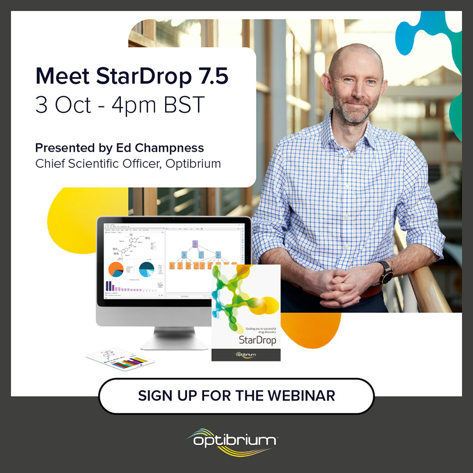 Image of webinar presenter Ed stood learning on a bannister in office, next to a computer displaying StarDrop drug discovery software's colourful visualisation capabilities