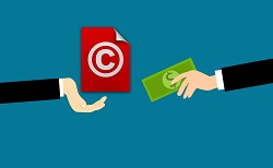 Graphic showing a copyright symbol being exchanged for money