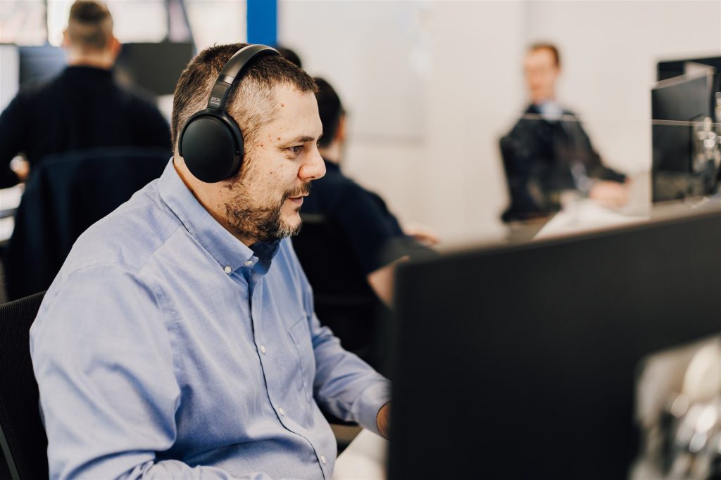 Cambridge Support employee Mark providing IT support at his desk