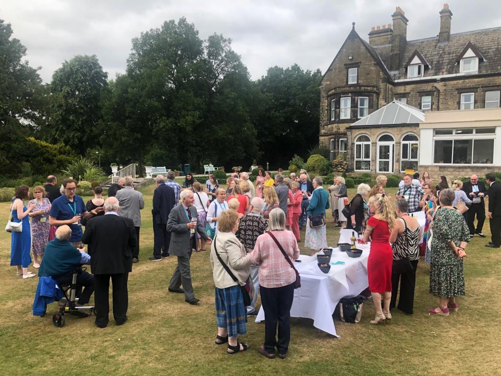 Party in front of stately home