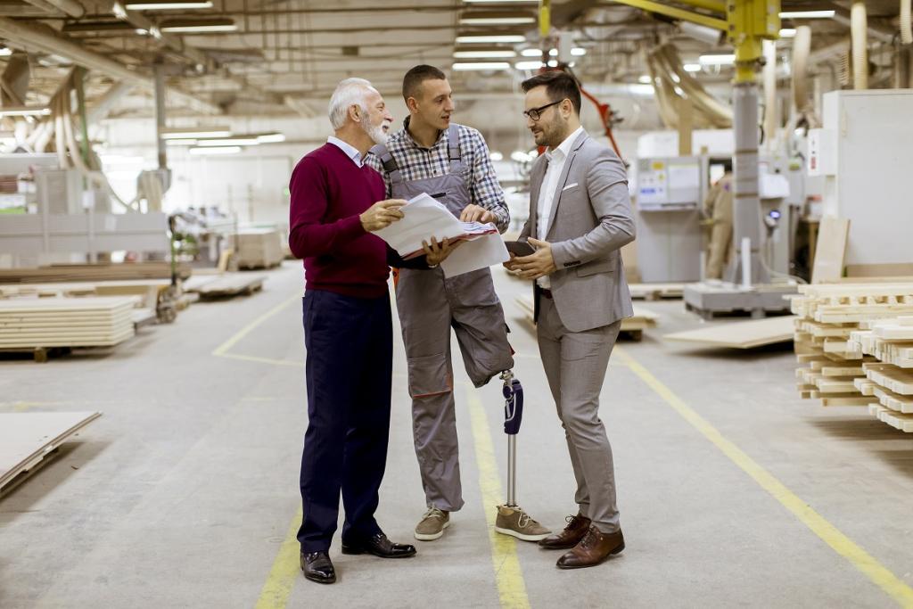 Disabled man working in the factory