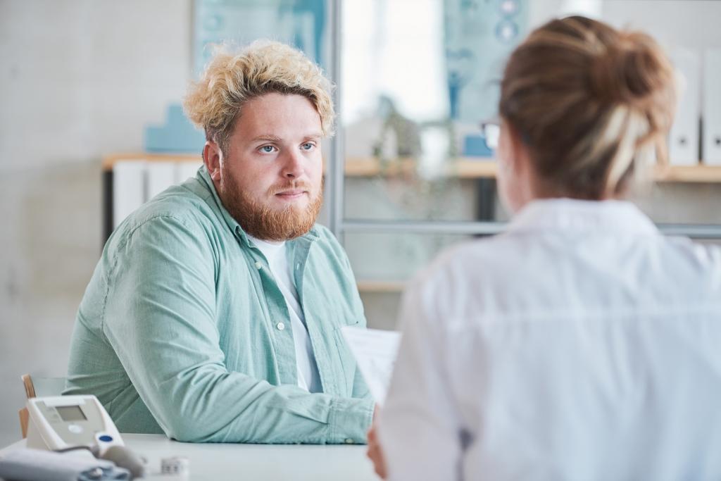 Man having an appointment to check his blood glucose levels