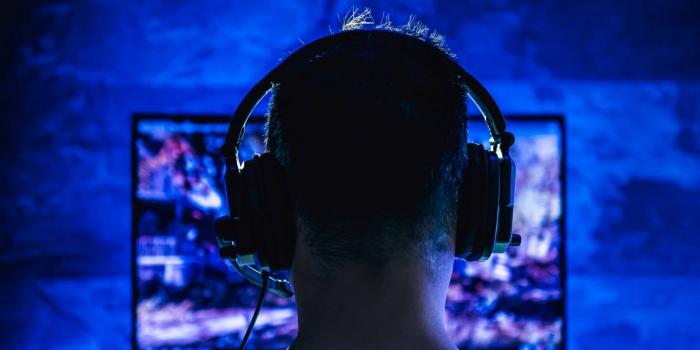 silhouette of gamer with headphones on