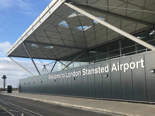 Welcome to London Stansted Airport sign outside terminal building