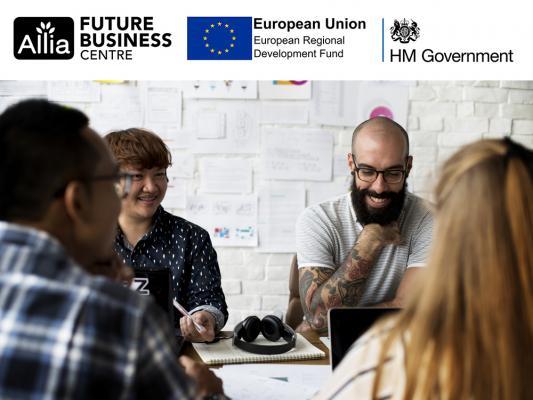 People sitting together at a table_Allia ERDF funding image