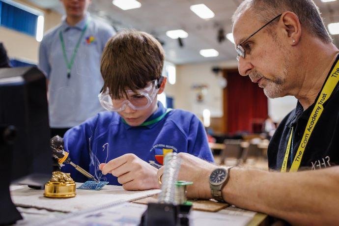 a man and boy working on stem activities 