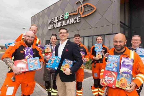 Will Phair and some other Magpas team holding Easter eggs