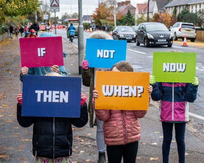 kids holding signs