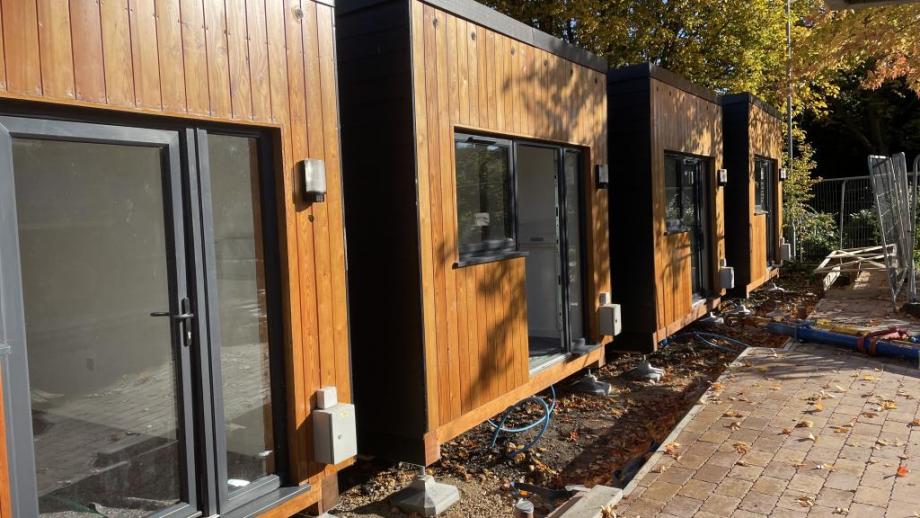 Four modular homes in a row in sunny weather