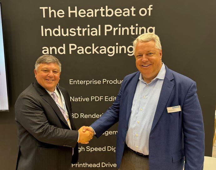 Mike Rottenborn CEO Hybrid Software and Pierre Hammond commercial director of Hamillroad Software celebrate their new partnership.jpg