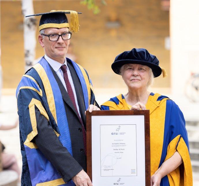A photograph of Dr Williams receiving her award from Professor Watkins is attached