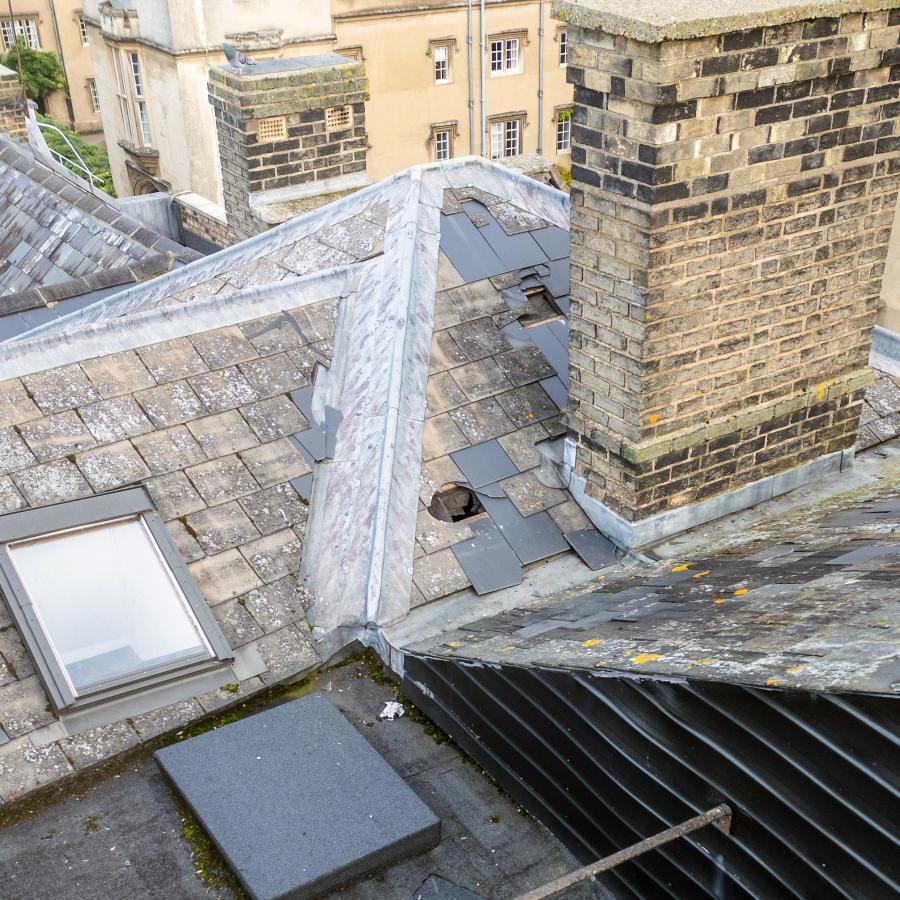 Drone roof survey photo showing extensive damage to roof tiles