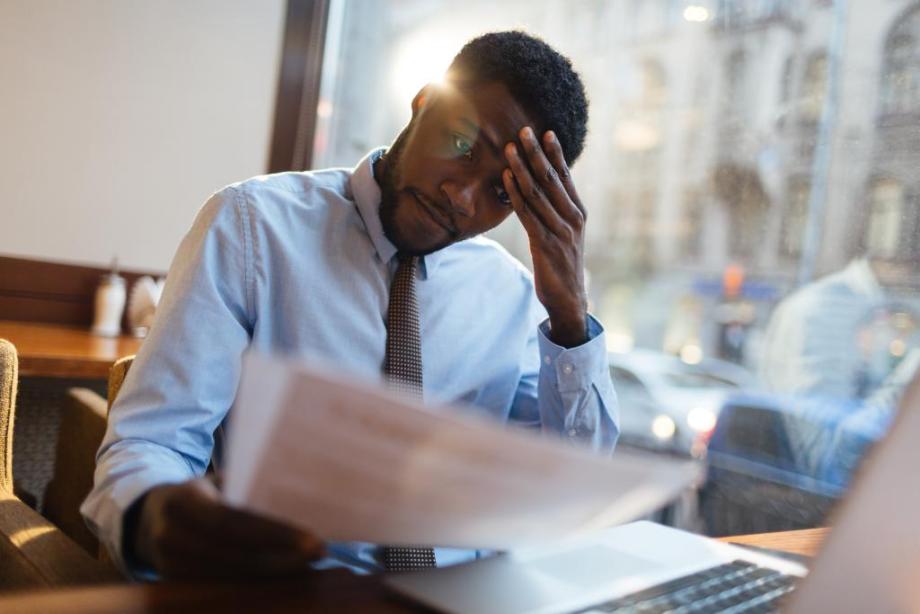 stressed man worried about paying his energy bill