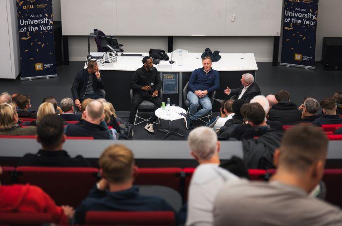 Garry Monk, Jason Euell and Michael Morrison answer questions at university event.