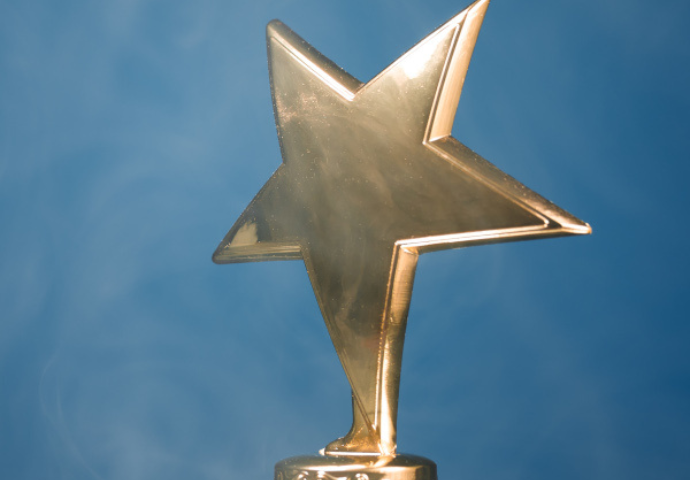 Gold star trophy with smoke blue background - Deposit photos 238123694