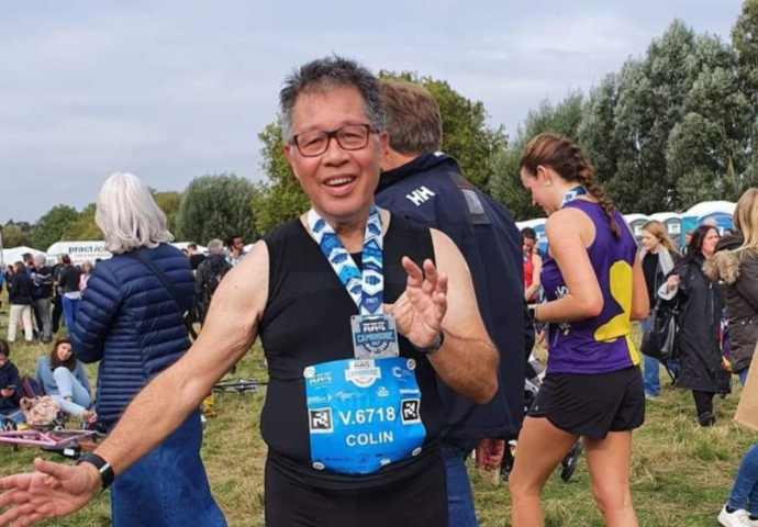 A previous Cogwheel runner displaying his medal