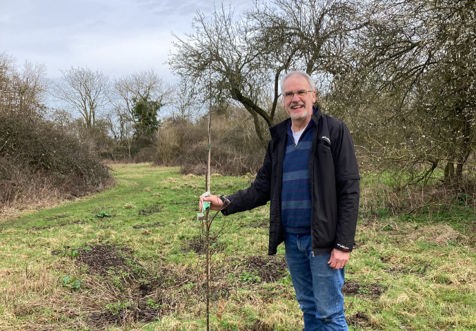 Man holding tree