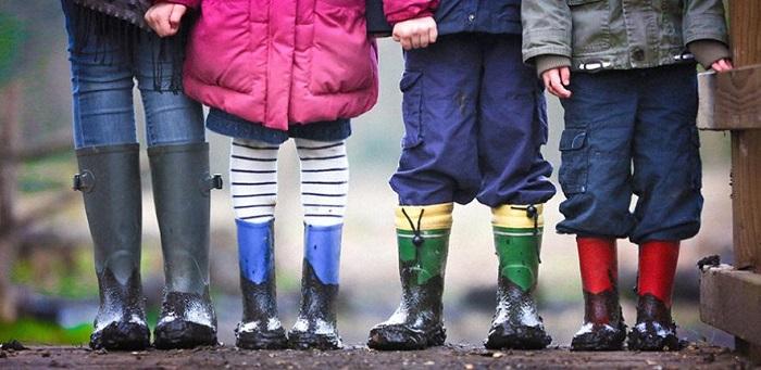   Children outdoors in muddy wellies  Credit: Ben Wicks on Unsplash