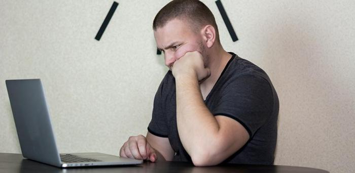   Man working at a laptop  Credit: Bermix Studio