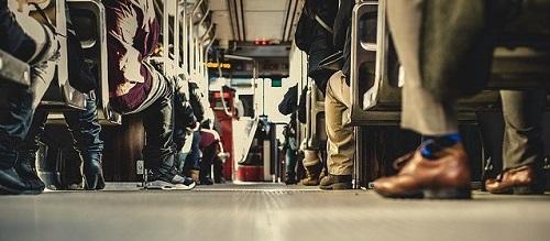 view of lots of commuters' feet on a bus_ Image by Free-Photos from Pixabay