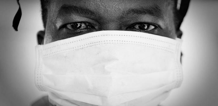   Doctor with face mask in the Fight Against Ebola in Sierra Leone  Credit: Defence Images