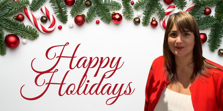 Christmas decor with the words Happy Holidays and image of Luciana Scrofani Green in a red blazer