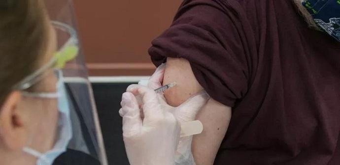 Person receiving COVID-19 Vaccine jab