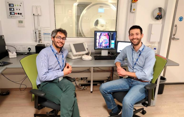 Psychiatrist Dr Emanuele Osimo (left) with cardiologist Dr Antonio De Marvao in front of the 3T Magnetic Resonance Imaging (MRI) scanner used for the study in the Robert Steiner MR Unit (Medical Research Council London Institute for Medical Sciences and Imperial College London).