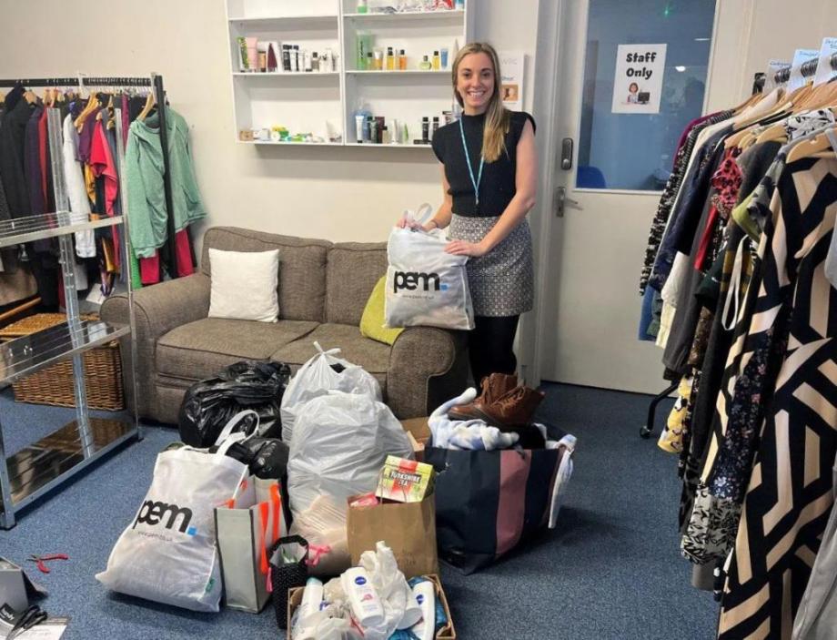 female sorting through clothes