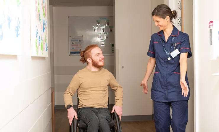 Person in a wheelchair with BioResource nurse