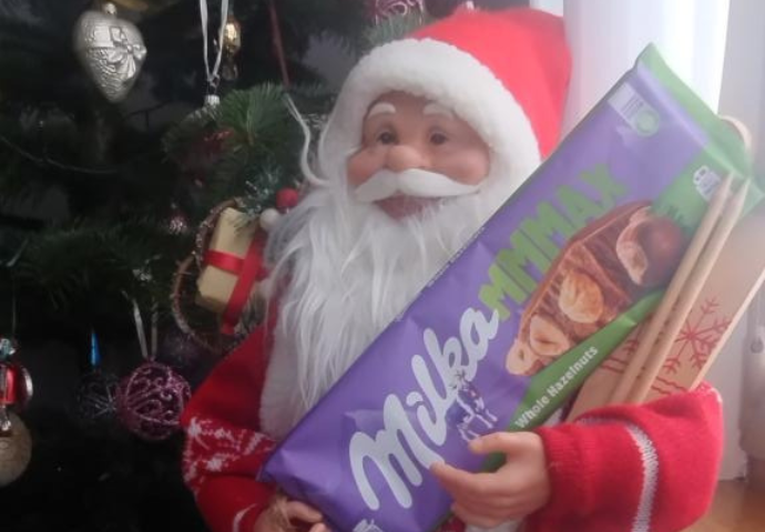  A father Christmas holding a block of chocolate 