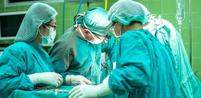   Surgeons at work in an operating theatre  Credit: Sasin Tipchai via Pixabay