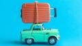 toy car with overloaded luggage on roofrack