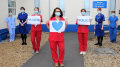 Doctors and nurses spell out the word' thank you' 